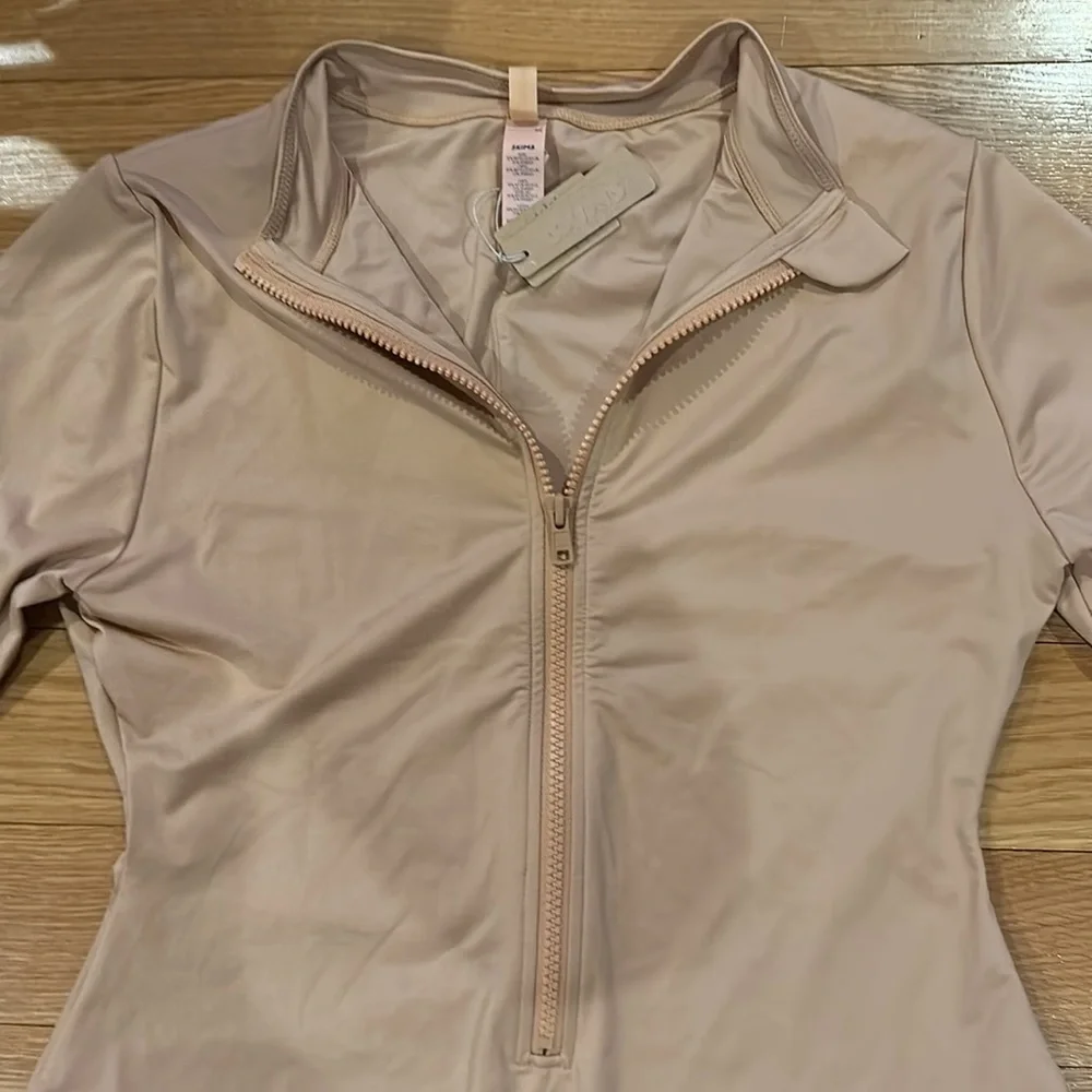 SKIMS SWIM ZIP FRONT LONG SLEEVE ONE PIECE in Ochre NEW
